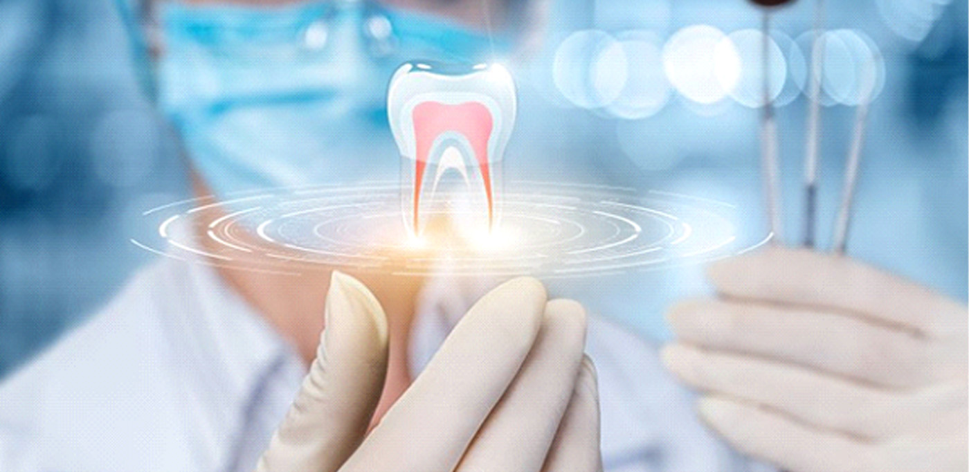 Technology concept, showing digital tooth image above medical professional’s hand