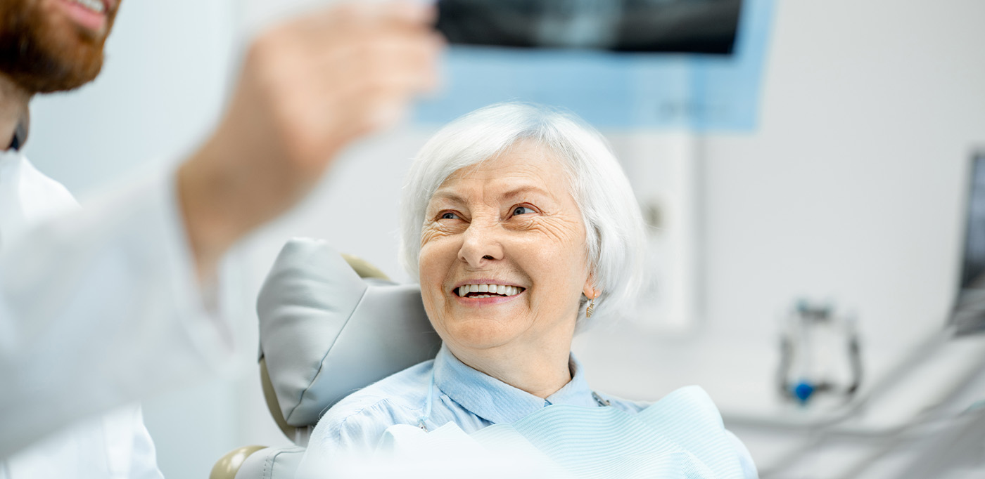 Dentist reviewing an X-ray with his patient