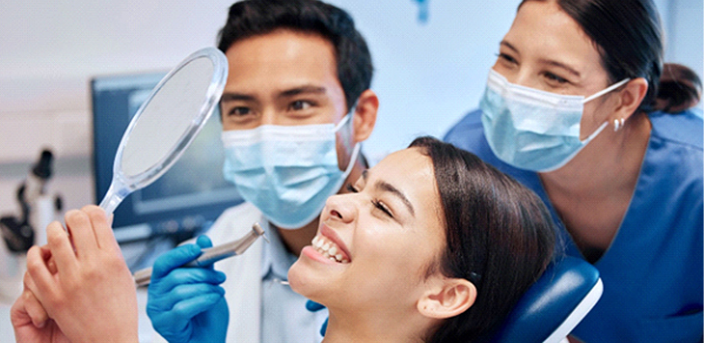 Teeth whitening patient in Baytown smiling at dentist